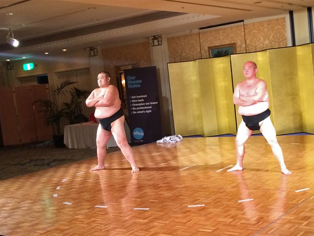 Sumo wrestlers demonstrating their moves at the welcome reception